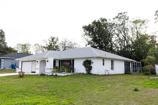 ranch-style home featuring concrete driveway, a front lawn, a garage, and stucco siding