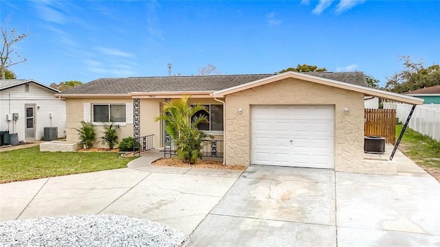 single story home with stucco siding, driveway, fence, a shingled roof, and a garage