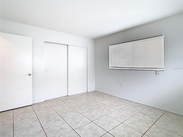 unfurnished bedroom featuring a closet