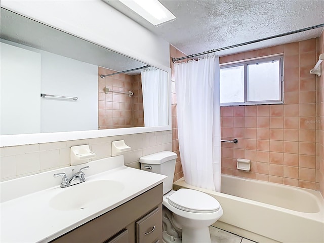 bathroom featuring toilet, shower / bath combo, a textured ceiling, tile walls, and vanity