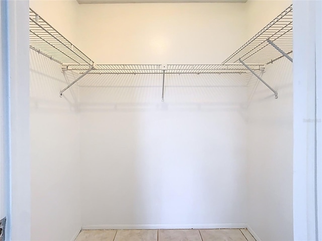 walk in closet featuring light tile patterned floors