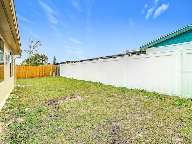 view of yard with a fenced backyard