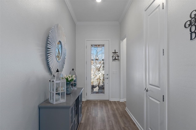 doorway to outside featuring dark wood finished floors, baseboards, and ornamental molding