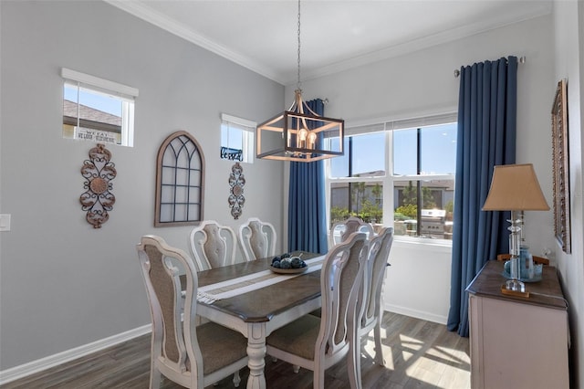 dining area with a wealth of natural light, baseboards, wood finished floors, and ornamental molding