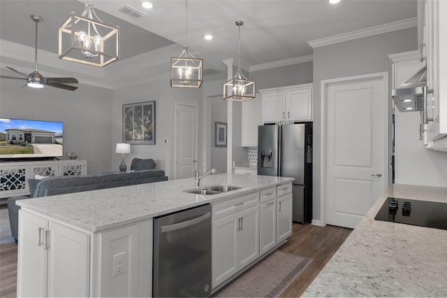 kitchen with a sink, visible vents, appliances with stainless steel finishes, and white cabinetry