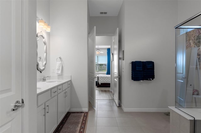 full bath featuring vanity, baseboards, visible vents, tile patterned floors, and connected bathroom