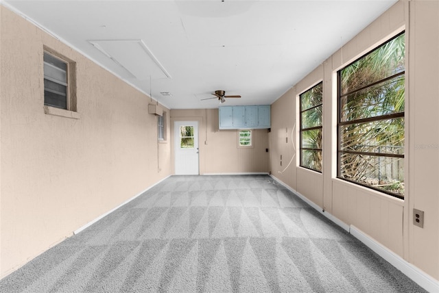 interior space featuring light carpet and attic access