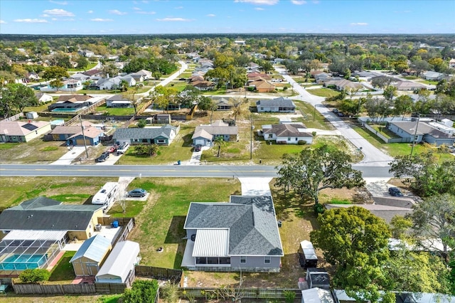 birds eye view of property with a residential view