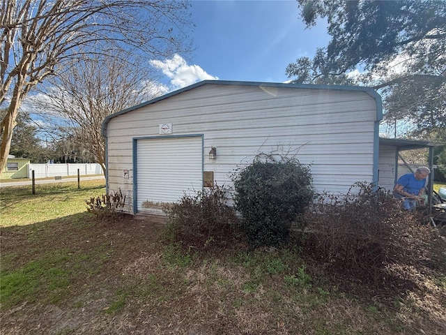 garage with fence