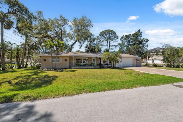 single story home with concrete driveway, a garage, and a front yard