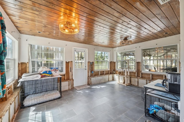 sunroom featuring wood ceiling