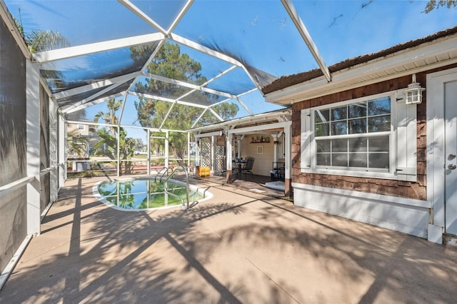 pool featuring a patio area and glass enclosure