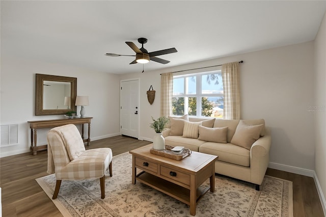 10841 Scenic Dr, Port Richey, FL 34668 - living room with wood finished floors and ceiling fan