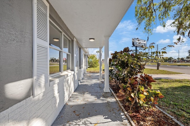 10841 Scenic Dr, Port Richey, FL 34668 - view of side of property featuring a porch