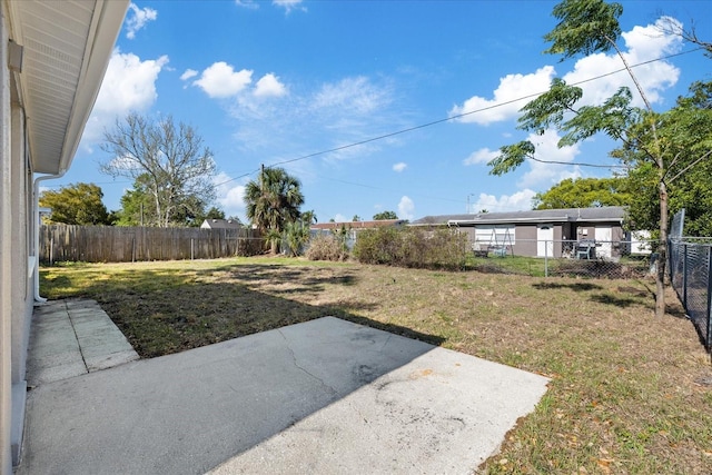 10841 Scenic Dr, Port Richey, FL 34668 - fenced backyard featuring a patio area