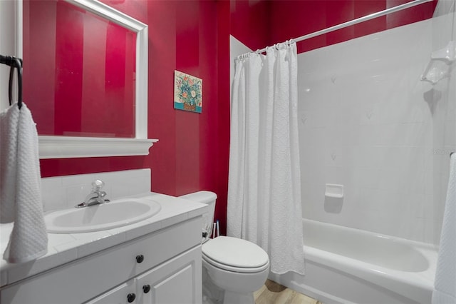 bathroom featuring shower / bath combo, toilet, vanity, and wood finished floors