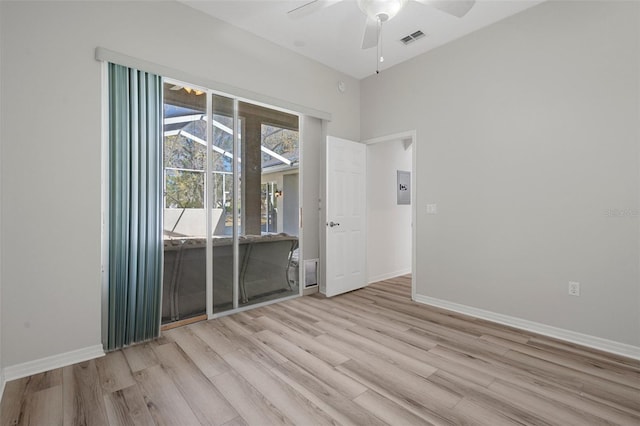 empty room featuring visible vents, ceiling fan, baseboards, and light wood-style floors