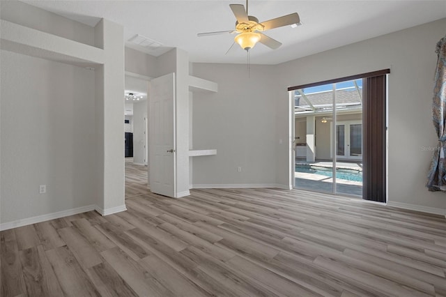 empty room with visible vents, baseboards, light wood-style floors, and ceiling fan