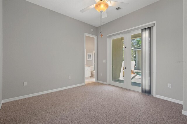 unfurnished room featuring light carpet, visible vents, french doors, and baseboards