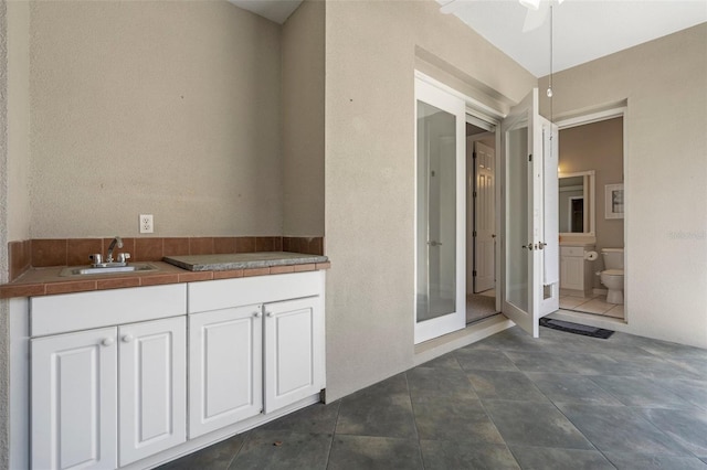 bathroom featuring toilet and a sink