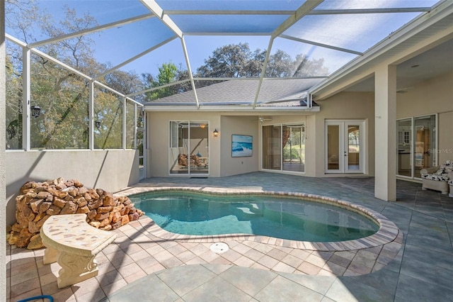 pool featuring french doors and a patio area