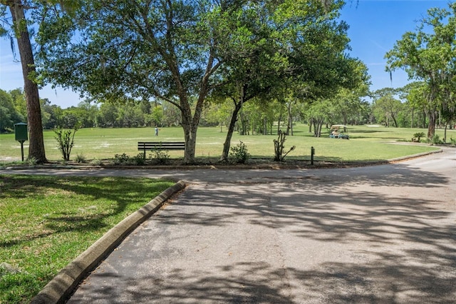 view of community featuring a lawn