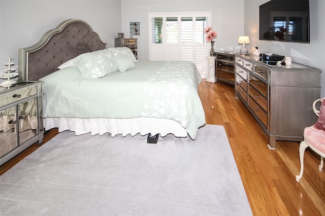 bedroom with light wood finished floors