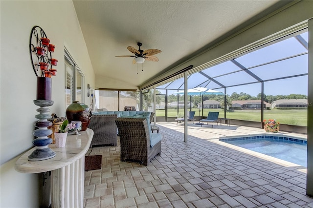 exterior space featuring ceiling fan, a jacuzzi, a lanai, and outdoor lounge area