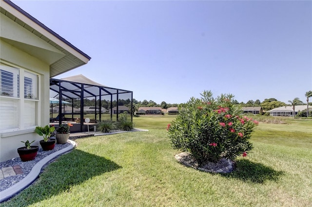 view of yard featuring a lanai