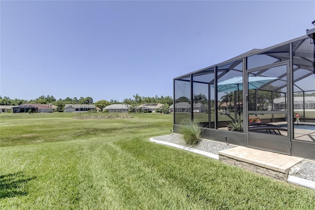 view of yard featuring a lanai and an outdoor pool