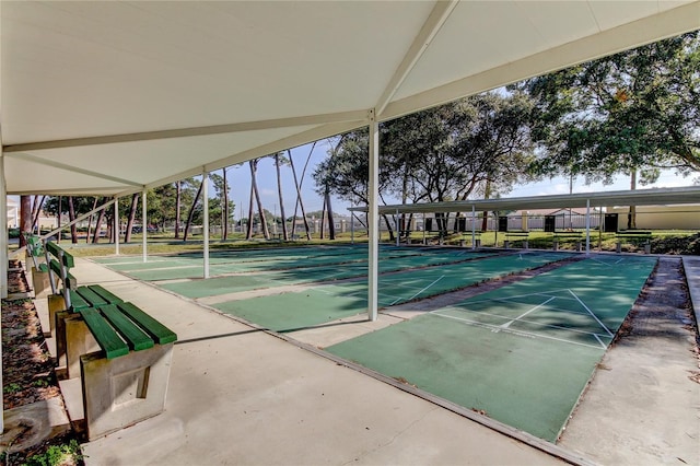 view of property's community featuring shuffleboard