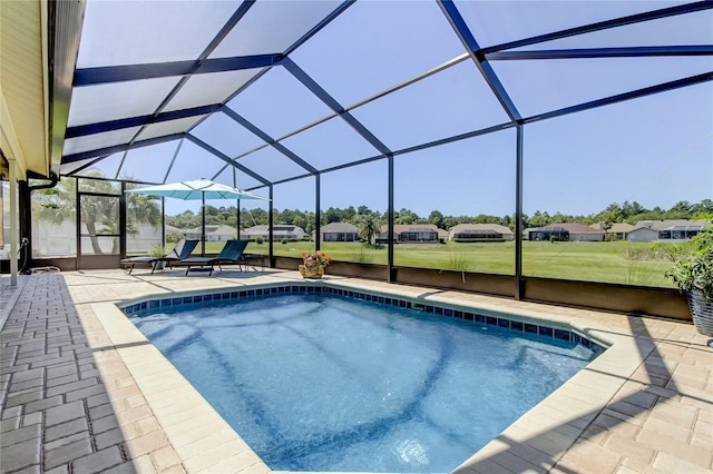8609 Regal Ln, Hudson, FL 34667 - outdoor pool with a patio, a lawn, a lanai, and a residential view