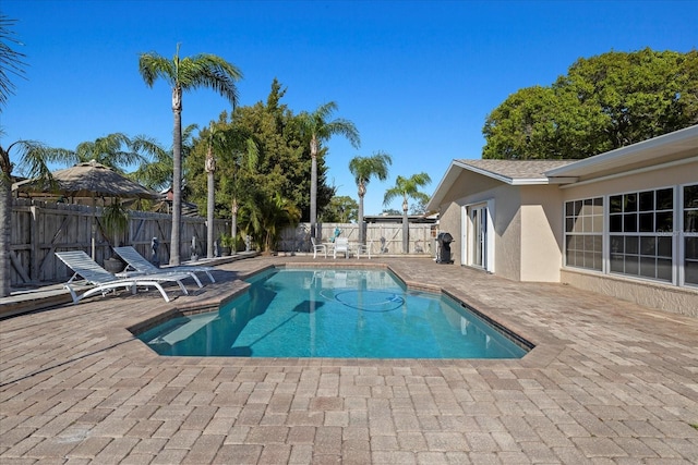 view of pool with a patio area, a fenced in pool, and a fenced backyard