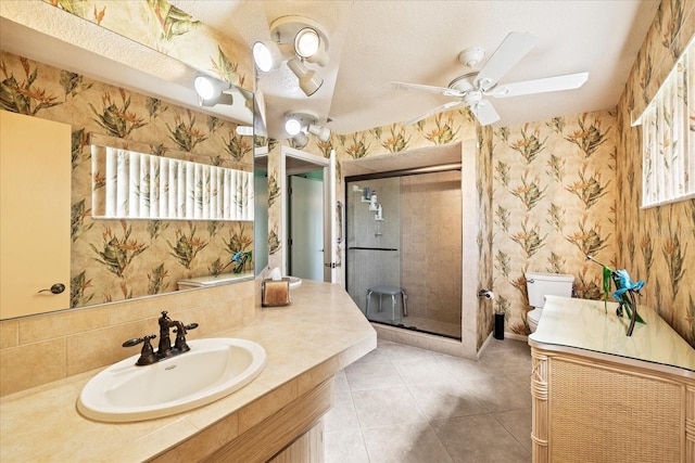 7901 Willow Brook Ct, Hudson, FL 34667 - bathroom featuring wallpapered walls, a shower stall, vanity, ceiling fan, and tile patterned flooring