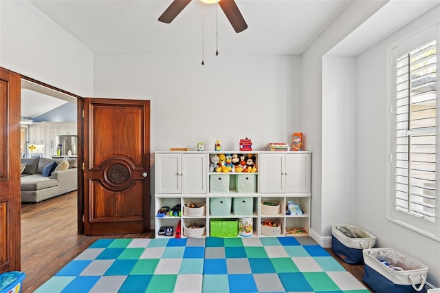 playroom featuring ceiling fan and wood finished floors