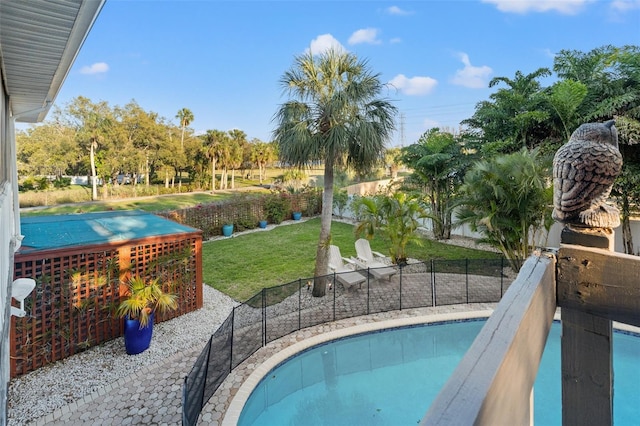 view of pool with a yard, a fenced in pool, and a fenced backyard