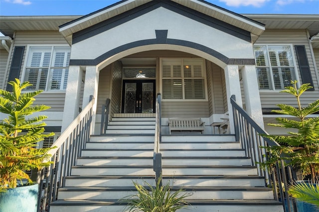 doorway to property featuring covered porch