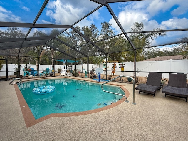 view of pool with a lanai, a fenced in pool, a patio, and a fenced backyard