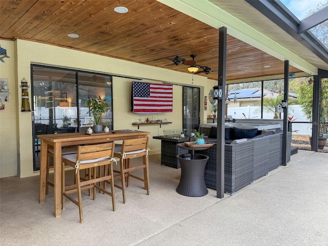 view of patio / terrace with outdoor dining area and a ceiling fan