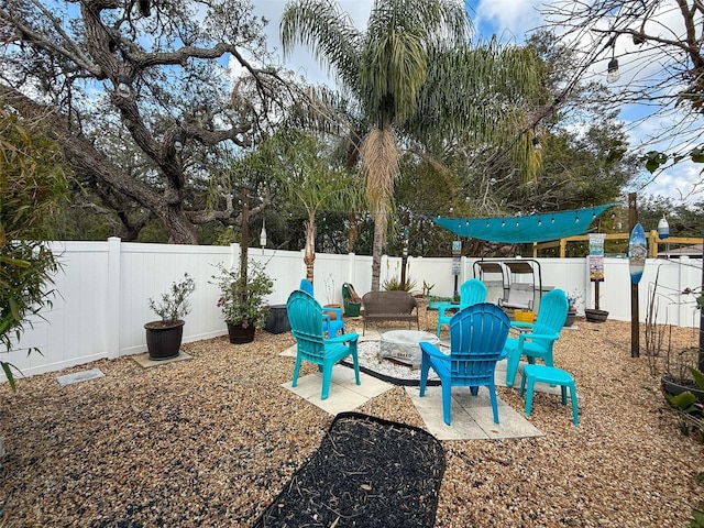 view of playground with a patio area and a fenced backyard