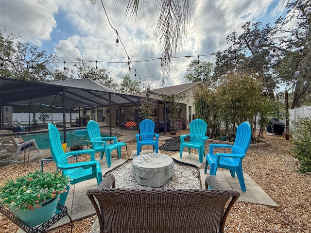 view of patio / terrace with a lanai and an outdoor pool