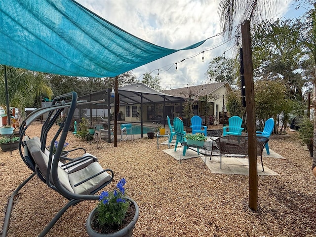 community jungle gym featuring a lanai, an outdoor pool, and a patio