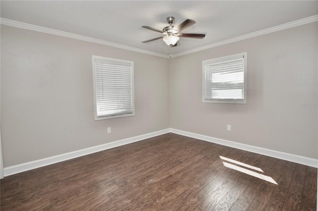 unfurnished room with dark wood finished floors, a ceiling fan, baseboards, and ornamental molding