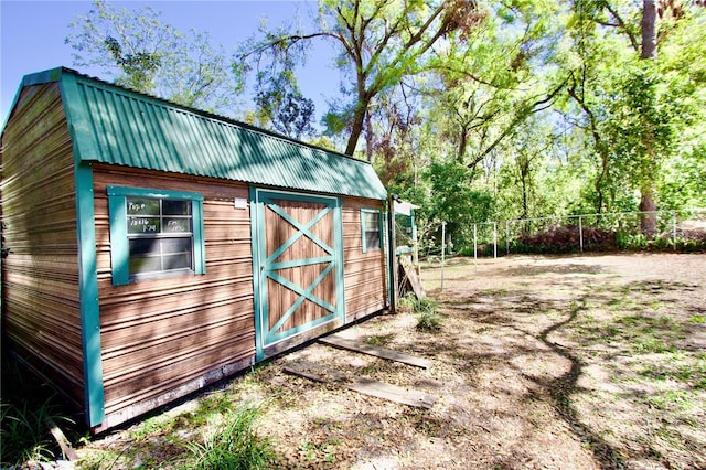 view of shed with fence