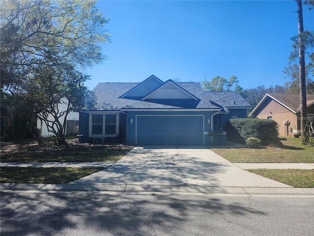 view of front of house featuring stucco siding, an attached garage, concrete driveway, and roof with shingles