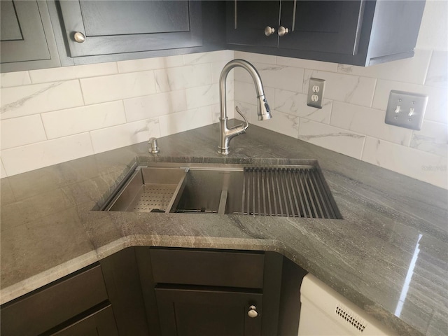 details featuring backsplash and a sink