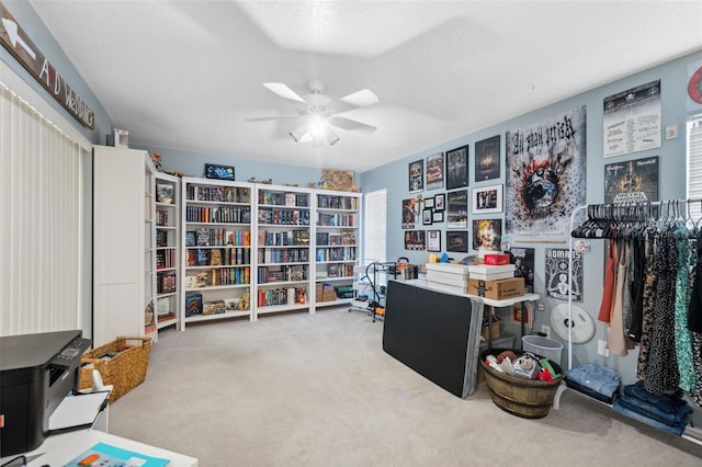 miscellaneous room featuring carpet floors and ceiling fan