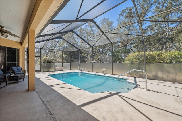 view of pool with a fenced in pool, a lanai, a ceiling fan, and a patio area