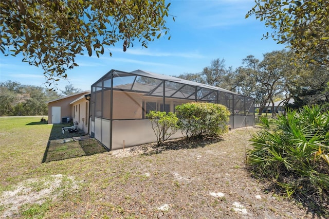 view of yard featuring glass enclosure