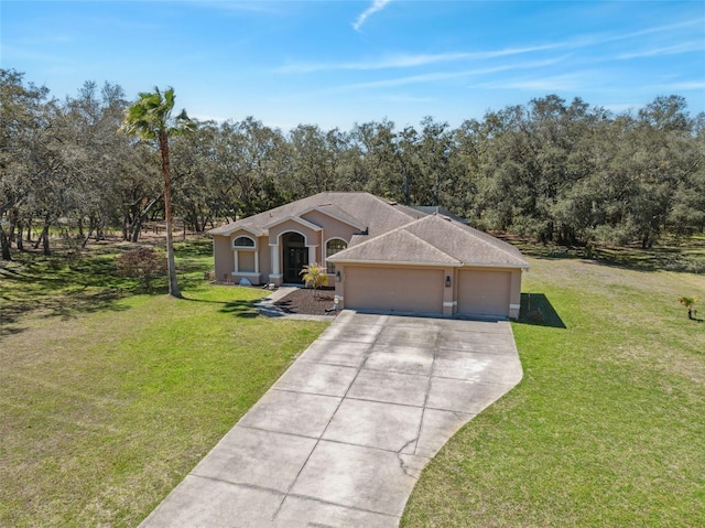 view of front of property featuring an attached garage, a shingled roof, stucco siding, a front lawn, and concrete driveway